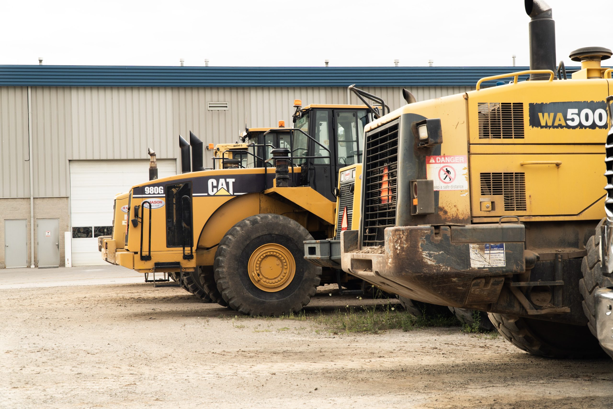 Several large loaders lined up